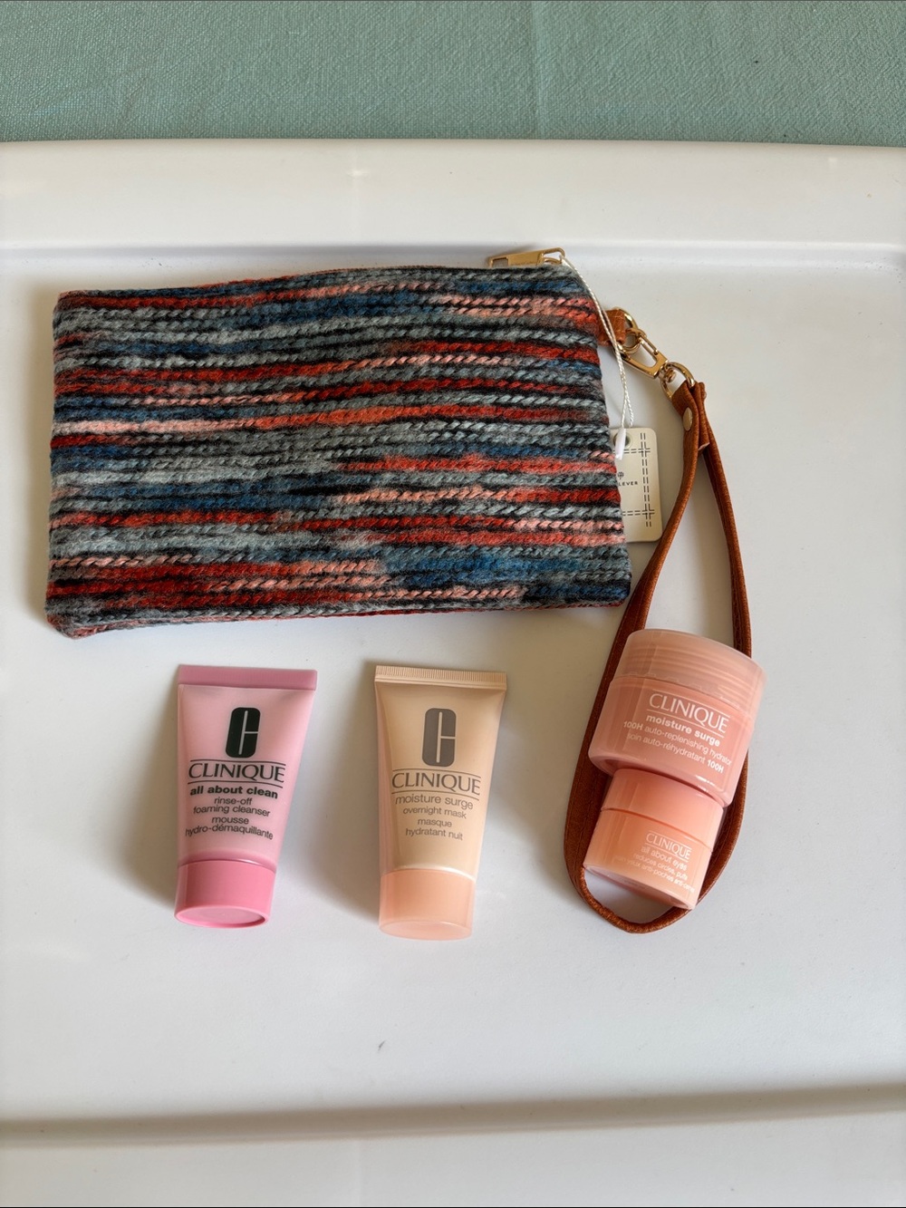 Clinique Pink and Peach Travel Skincare Set with Striped Wristlet